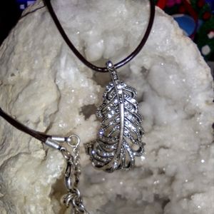 Vintage fossil feather marcasite on leather